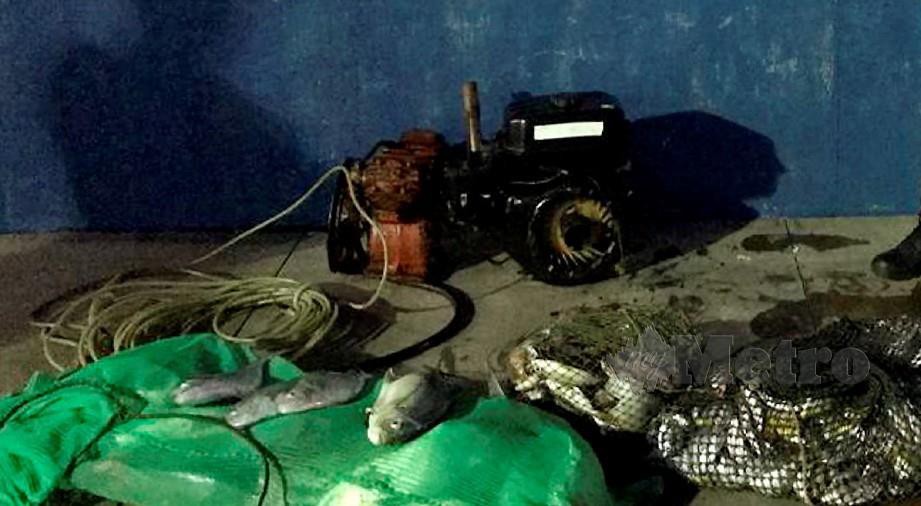 ANTARA peralatan mengebom dan ikan yang dirampas Pasukan Polis Marin (PPM) di perairan Lumanggas, di Semporna. FOTO Ihsan PPM. 