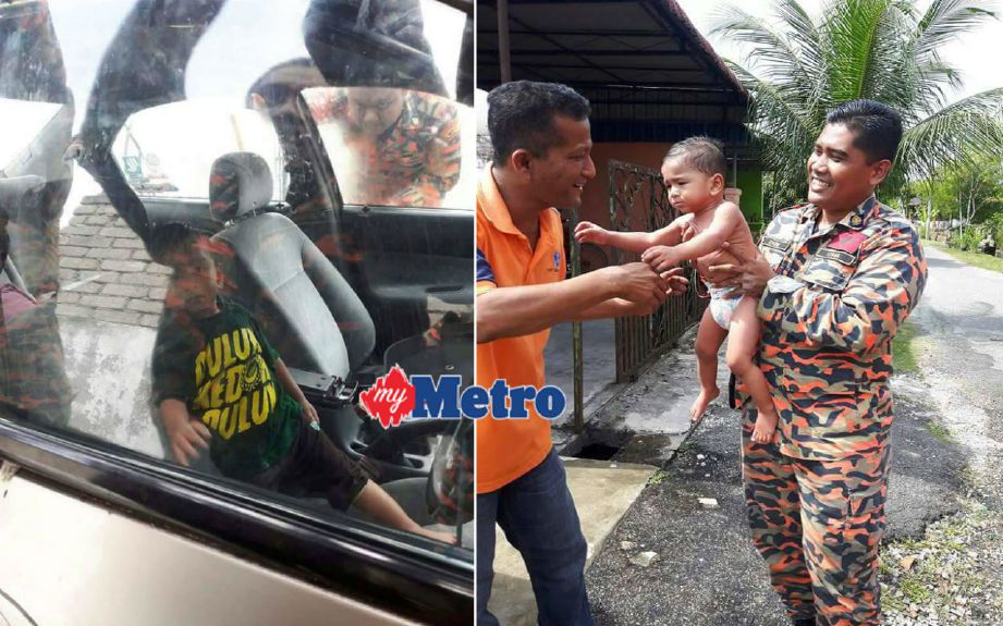 Anggota bomba menyerahkan Ahmad Amsyar Naufal kepada bapanya selepas dibawa keluar dari kereta yang terkunci di Taman Mutiara. FOTO ihsan ahli ICJ.