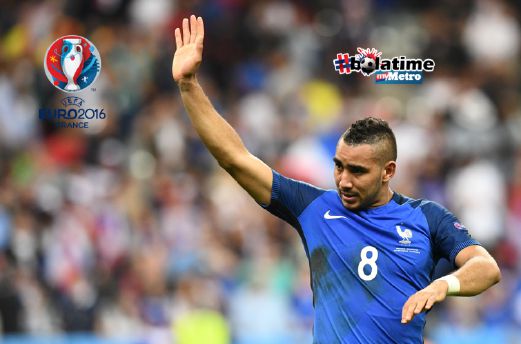 FRANCE'S forward Dimitri Payet celebrates after scoring the 2-1 during the Euro 2016 group A football match between France and Romania at Stade de France, in Saint-Denis, north of Paris. FOTO AFP