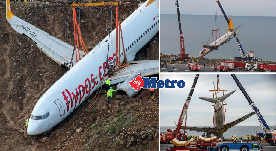 Dua kren digunakan bagi mengangkat Boeing 737-800 milik syarikat penerbangan tambang murah Turki, Pegasus Airlines, yang terbabas di  Lapangan Terbang Trabzon, Turki, hari ini. - Foto REUTERS/AFP