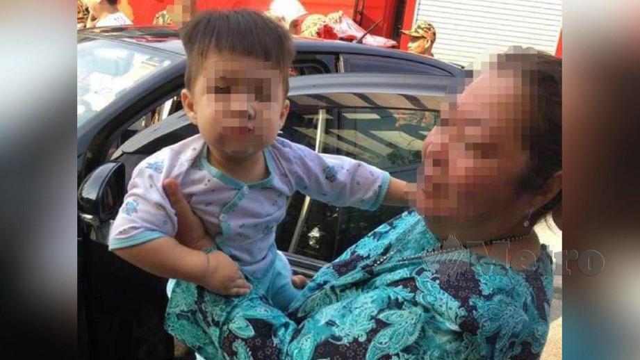 IBU kepada bayi berusia lapan bulan yang terperangkap di dalam kereta lega selepas anaknya itu diselamatkan bomba. FOTO Ihsan Bomba