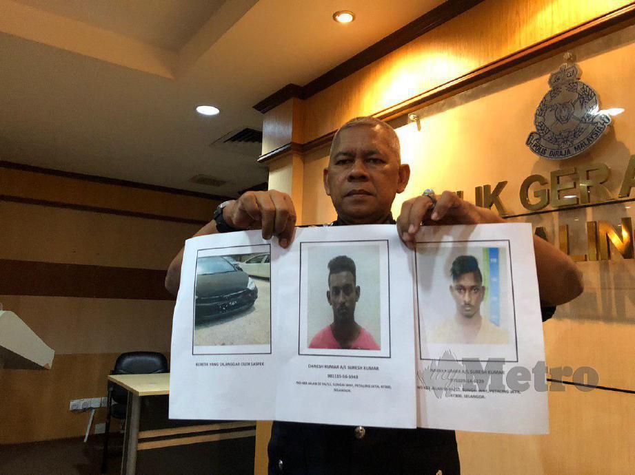  MOHD Zani Che Din menunjukkan gambar dua suspek yang meloloskan diri daripada ditahan polis. FOTO Ihsan Polis