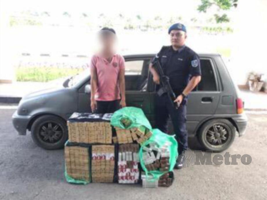  SUSPEK ditahan bersama  1,570 bungkus rokok seludup oleh Pasukan Polis Marin. FOTO Ihsan PPM