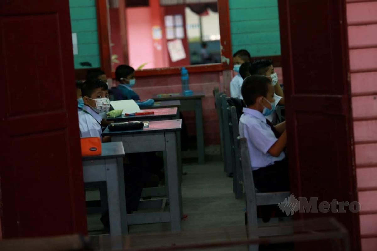 Gelagat murid-murid pada hari pertama persekolah ketika tinjauan di Sekolah Kebangsaan Cator Avenue. FOTO / SHARUL HAFIZ ZAM