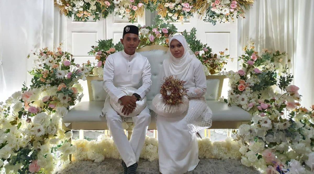 NORHAFIZATUL Akmar bersama suami Mohd Shafiq diwalikan abang kandung bagi meneruskan majlis akad nikah. FOTO Ihsan Norhafizatul Akmar
