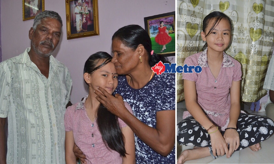 Poh Li  bersama ibu dan bapa angkatnya, V Pichay (kanan) dan K Krishnan. - Foto ROSMAN SHAMSUDIN