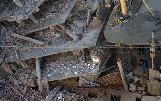 Bangunan yang musnah di Imphal, India. - Foto AFP