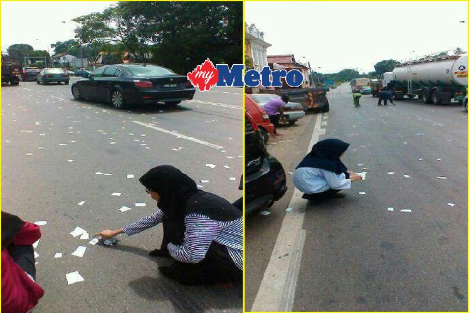Orang ramai mengumpul cebisan al-Quran yang bertaburan di atas jalan Yong Peng - Segamat, berhampiran bank di Labis, Johor, semalam. - Foto Fail (Ihsan Pembaca)