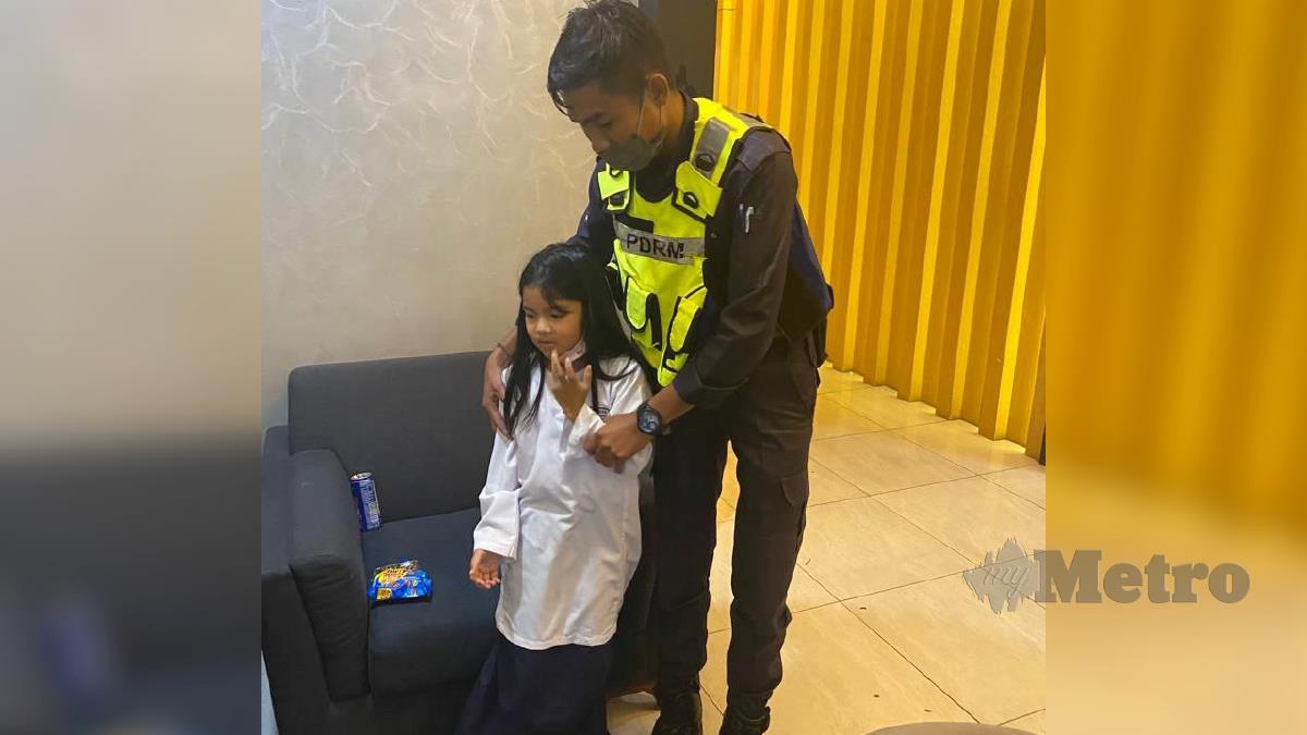 SOFIA Raniya ketika bersama anggota polis. FOTO  Ihsan Polis