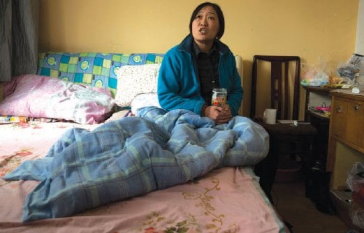 LI Xiaohe tinggal di bilik sempit sepanjang tempoh rawatan kemoterapinya.
