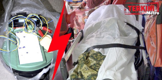 Mayat mangsa dibawa ke hospital. Peralatan digunakan untuk mengecas bateri motosikal (kiri). FOTO Danial Noordin