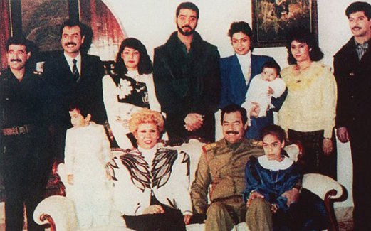 RAGHAD (berdiri, tiga dari kanan) bersama keluarganya tidak lama sebelum melarikan diri ke Jordan.
