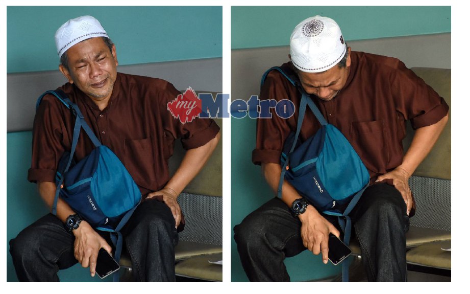 Norhisham tidak dapat menahan kesedihan selepas anaknya maut dalam kemalangan. FOTO Mohd Asri Saifuddin Mamat