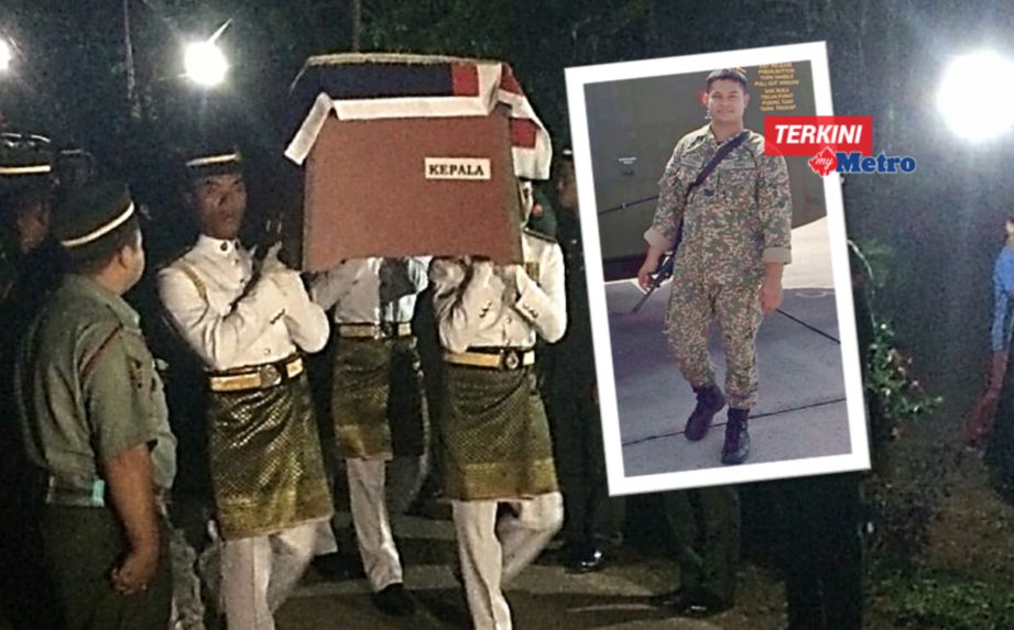 JENAZAH Koperal Mohd Faizol Rosli bawa ke Tanah Perkuburan Islam Kampung Kuala Kuang, Baling. FOTO Aizat Sharif 