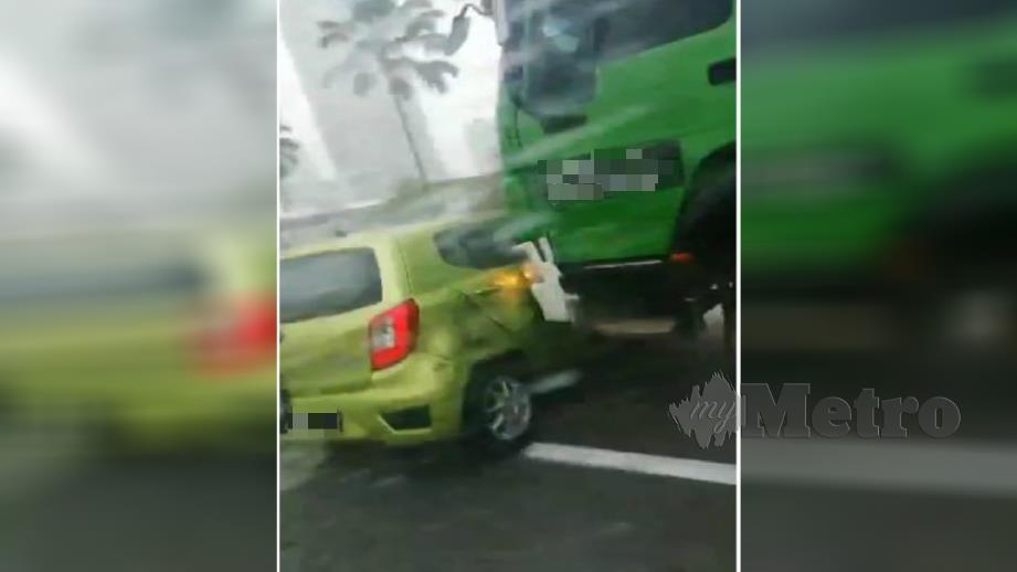 Gambar daripada rakaman video kejadian lori simen seret kereta di Jalan Klang Lama, Kuala Lumpur  yang tular di media sosial. Foto Ihsan Pembaca