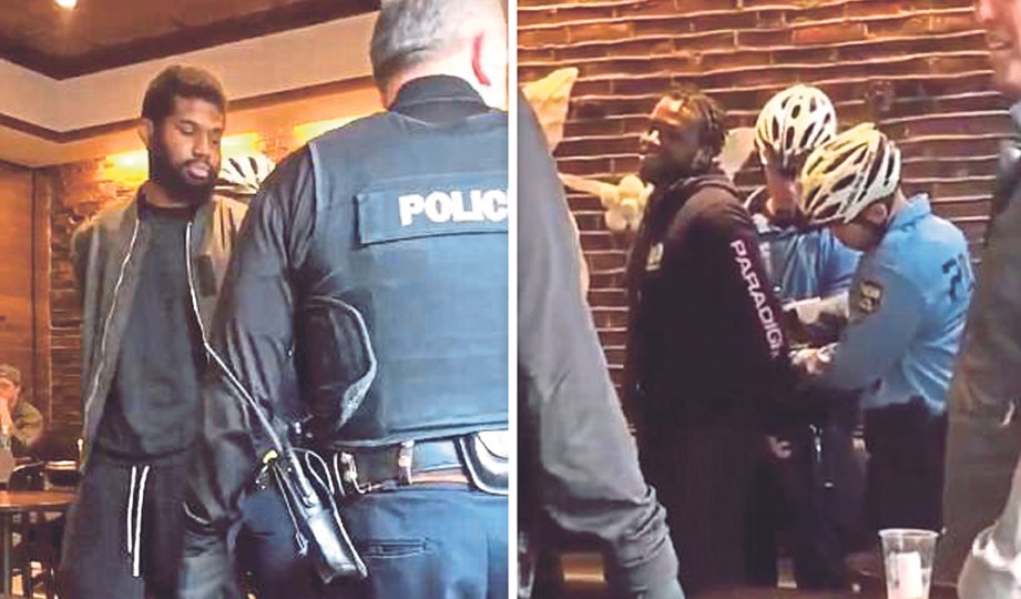 DUA lelaki kulit hitam yang ditahan polis di Starbucks cawangan Philadelphia, minggu lalu. FOTO Twitter/Melissa DePino