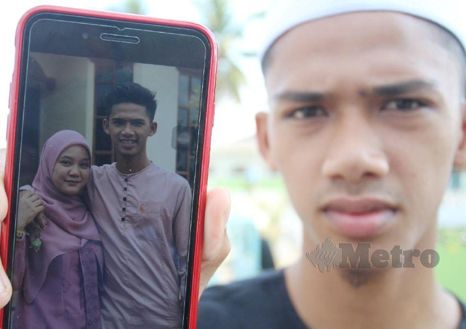 SYAZWAN Najmi menunjukkan gambar isterinya, Siti Nur Nasuha Shafie, 23. FOTO Nik Abdullah Nik Omar