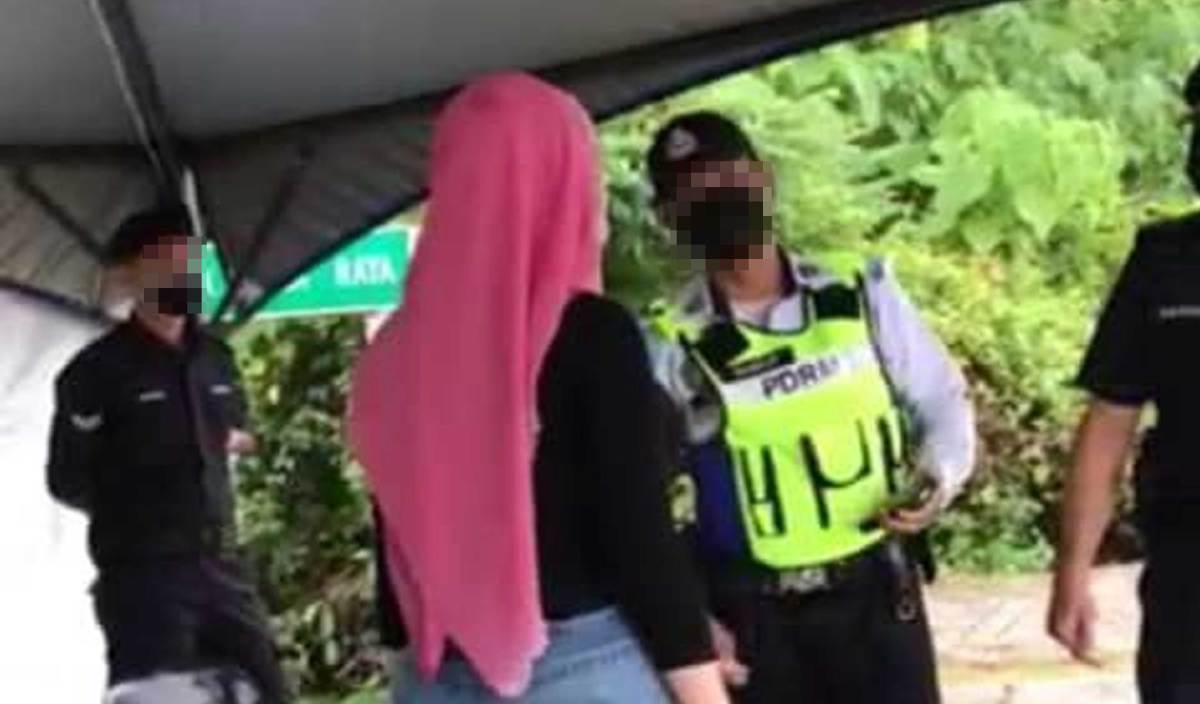 KETEGANGAN antara wanita dan anggota polis dalam rakaman yang tular di media sosial, sejak semalam. FOTO Ihsan pembaca