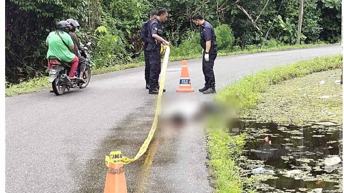 POLIS menjalankan siasatan di lokasi penemuan mayat lelaki. FOTO Melvin Joni. 