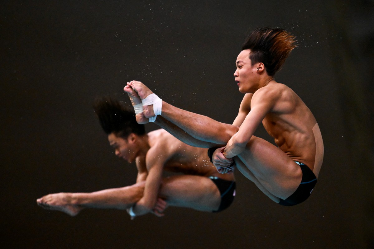 BERTRAND dan Enrique ketika beraksi dalam acara 10 meter platform seirama di Montreal, Kanada. FOTO AFP