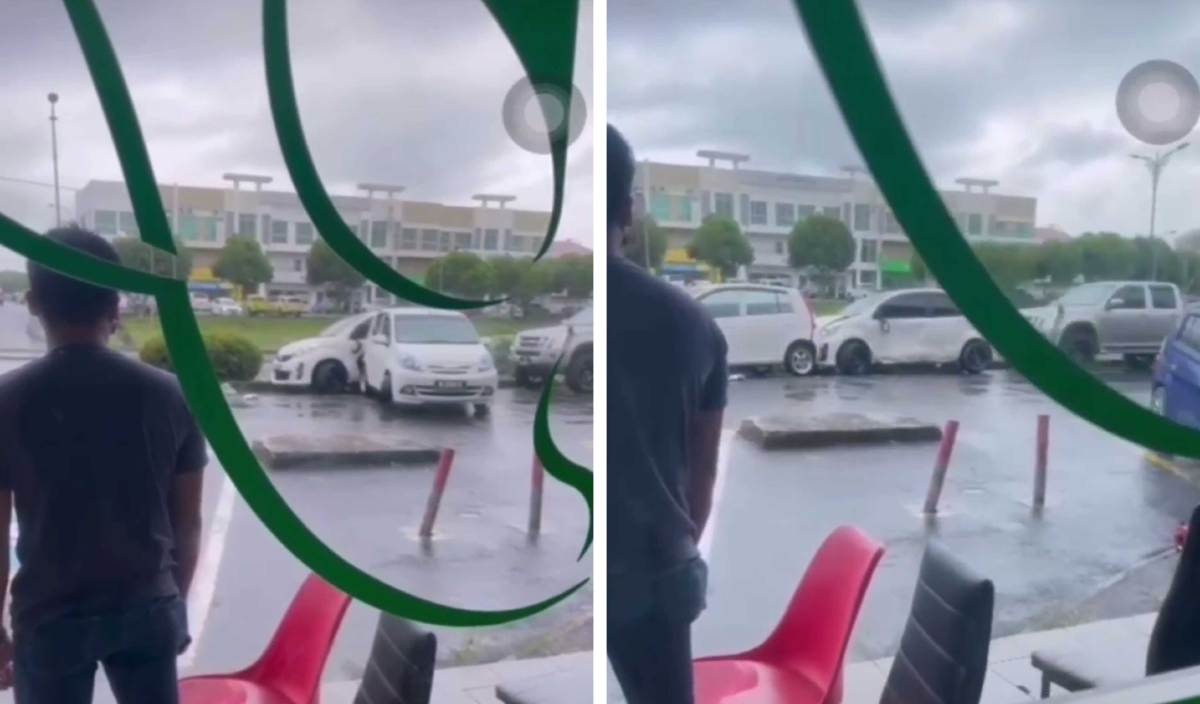 TANGKAP layar tular video berdurasi 30 saat menunjukkan sebuah kenderaan dengan sengaja dipandu melanggar sebuah kenderaan lain di parkir di Bandar Indah, Sandakan. FOTO Tular