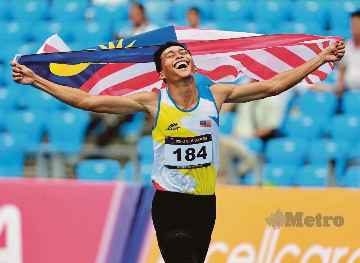 UMAR mencipta rekod kebangsaan dengan catatan masa 46.34s sekali gus  memenangi acara 400m di Sukan Sea Kemboja. FOTO FATHIL ASRI