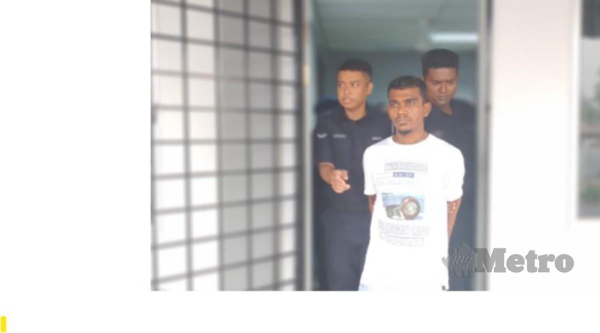 PUVEENDRAN ketika dibawa ke Mahkamah Magisterat Port Dickson. FOTO Mohd Khidir Zakaria