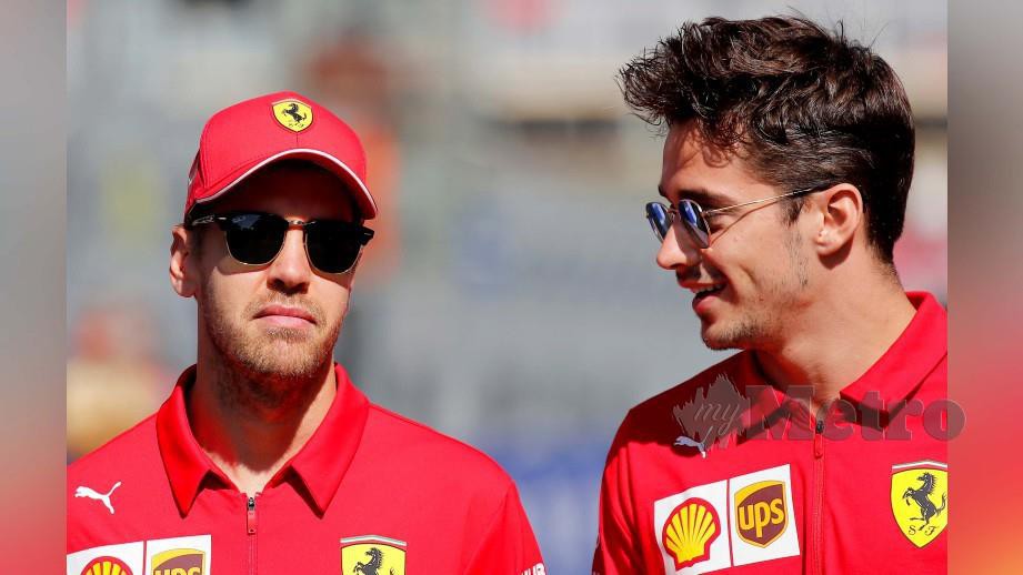 Vettel (kiri) dan Leclerc bermusuhan di litar lumba. FOTO REUTERS 